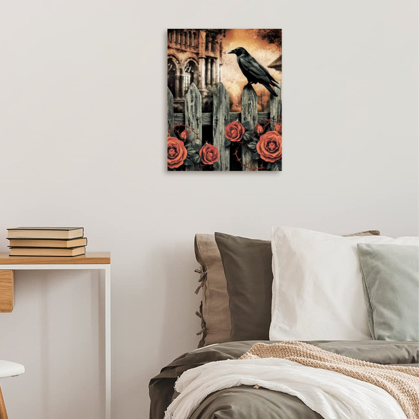 Canvas print with a crow and roses on a wall above a bed.
